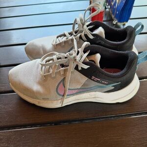 Nike Black and White Sneakers with Pink Accents